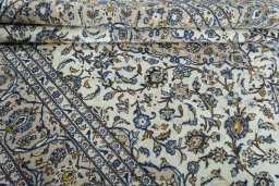 Close-up detail of 2000s Kashan rug from Iran / Persia showing Wool weave