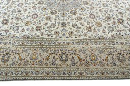 Corner detail of 2000s Kashan rug showing border pattern and Wool pile