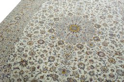Backside of handmade 2000s Kashan rug showing knot structure and weave density