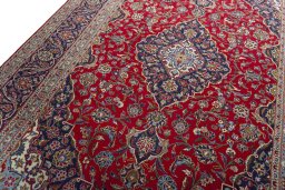 Backside of handmade 2000s Kashan rug showing knot structure and weave density