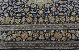 Corner detail of 2000s Kashan rug showing border pattern and Wool pile