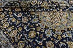 Close-up detail of 2000s Kashan rug from Iran / Persia showing Wool weave