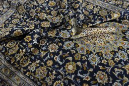 Surface texture of 2000s Kashan rug with natural Wool and intricate pattern