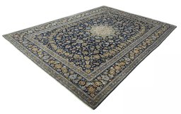 Corner detail of 2000s Kashan rug showing border pattern and Wool pile