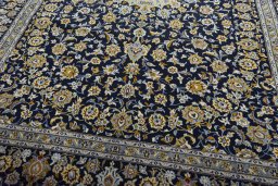 Close-up detail of 2000s Kashan rug from Iran / Persia showing Wool weave