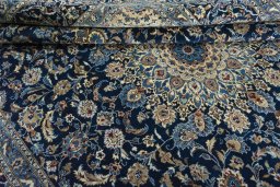 Close-up detail of 2000s Kashan rug from Iran / Persia showing Wool weave
