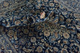 Surface texture of 2000s Kashan rug with natural Wool and intricate pattern