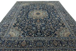 Surface texture of 2000s Kashan rug with natural Wool and intricate pattern
