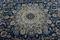 Central medallion detail of 2000s Kashan rug from Iran / Persia