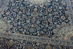 Close-up detail of 2000s Kashan rug from Iran / Persia showing Wool weave