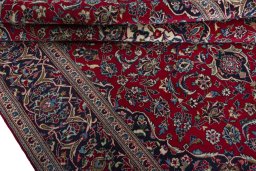 Close-up detail of 2000s Kashan rug from Iran / Persia showing Wool weave