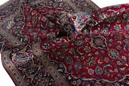 Surface texture of 2000s Kashan rug with natural Wool and intricate pattern