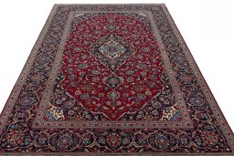 Surface texture of 2000s Kashan rug with natural Wool and intricate pattern