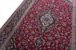 Backside of handmade 2000s Kashan rug showing knot structure and weave density