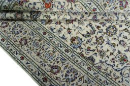 Close-up detail of 2000s Kashan rug from Iran / Persia showing Wool weave