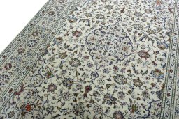 Backside of handmade 2000s Kashan rug showing knot structure and weave density