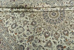 Close-up detail of 2000s Kashan rug from Iran / Persia showing Wool weave