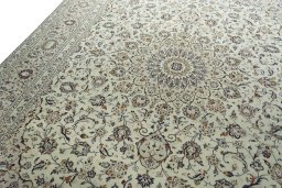 Backside of handmade 2000s Kashan rug showing knot structure and weave density
