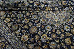 Close-up detail of 2000s Kashan rug from Iran / Persia showing Wool weave