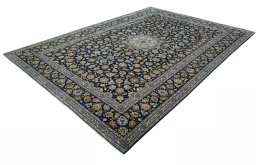 Corner detail of 2000s Kashan rug showing border pattern and Wool pile