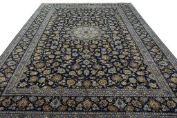 Surface texture of 2000s Kashan rug with natural Wool and intricate pattern