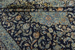 Close-up detail of 2000s Kashan rug from Iran / Persia showing Wool weave
