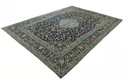 Corner detail of 2000s Kashan rug showing border pattern and Wool pile