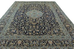 Surface texture of 2000s Kashan rug with natural Wool and intricate pattern