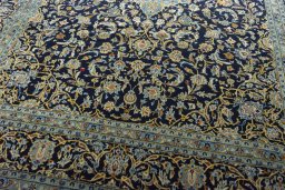 Close-up detail of 2000s Kashan rug from Iran / Persia showing Wool weave