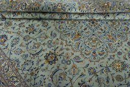 Close-up detail of 2000s Kashan rug from Iran / Persia showing Wool weave