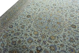 Backside of handmade 2000s Kashan rug showing knot structure and weave density