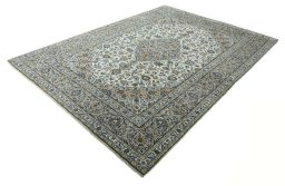 Corner detail of 2000s Kashan rug showing border pattern and Wool pile