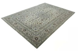 Corner detail of 2000s Kashan rug showing border pattern and Wool pile