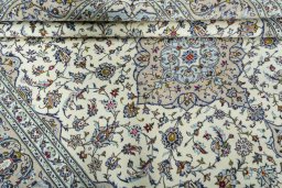 Close-up detail of 2000s Kashan rug from Iran / Persia showing Wool weave