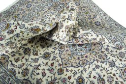 Surface texture of 2000s Kashan rug with natural Wool and intricate pattern