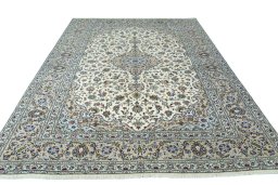 Surface texture of 2000s Kashan rug with natural Wool and intricate pattern