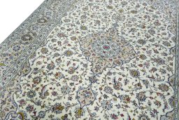 Backside of handmade 2000s Kashan rug showing knot structure and weave density
