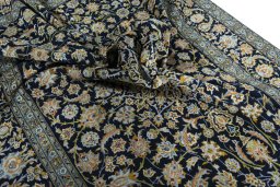Surface texture of 2000s Kashan rug with natural Wool and intricate pattern