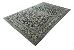 Corner detail of 2000s Kashan rug showing border pattern and Wool pile