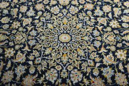 Central medallion detail of 2000s Kashan rug from Iran / Persia