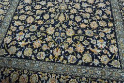 Close-up detail of 2000s Kashan rug from Iran / Persia showing Wool weave