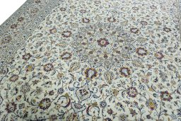 Backside of handmade 2000s Kashan rug showing knot structure and weave density
