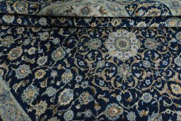 Close-up detail of 2000s Kashan rug from Iran / Persia showing Wool weave