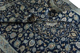 Surface texture of 2000s Kashan rug with natural Wool and intricate pattern