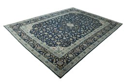 Corner detail of 2000s Kashan rug showing border pattern and Wool pile