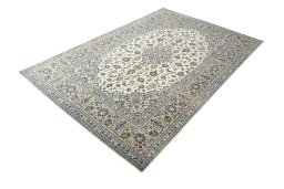 Corner detail of 2000s Kashan rug showing border pattern and Cork pile