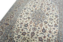 Backside of handmade 2000s Kashan rug showing knot structure and weave density
