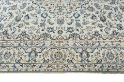 Corner detail of 2000s Kashan rug showing border pattern and Wool pile