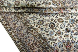 Close-up detail of 2000s Kashan rug from Iran / Persia showing Wool weave
