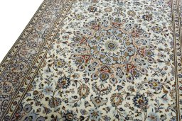 Backside of handmade 2000s Kashan rug showing knot structure and weave density
